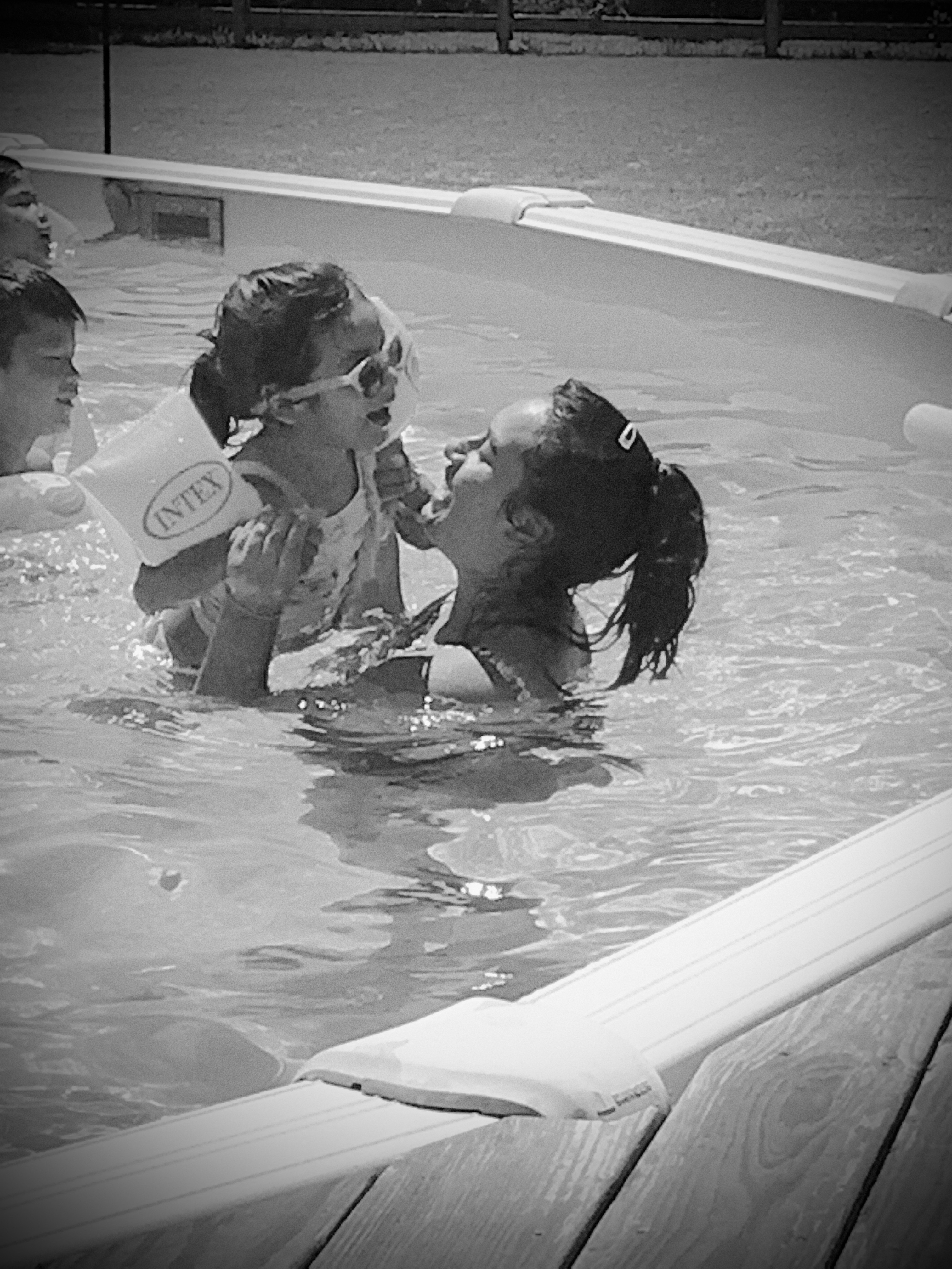 Playing in the pool with Mommy